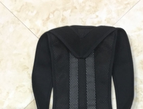 Black backpack with mesh back panel on a light tiled floor