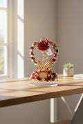 Decorative flower arrangement with red roses and gold accents on a white background
